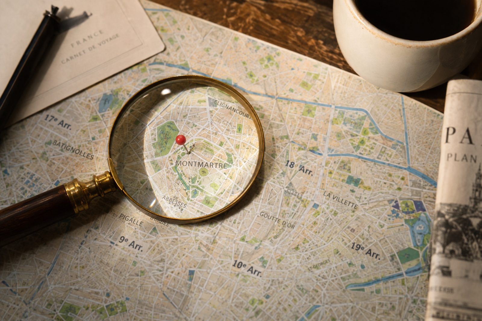 A magnifying glass over a map showing one neighbourhood